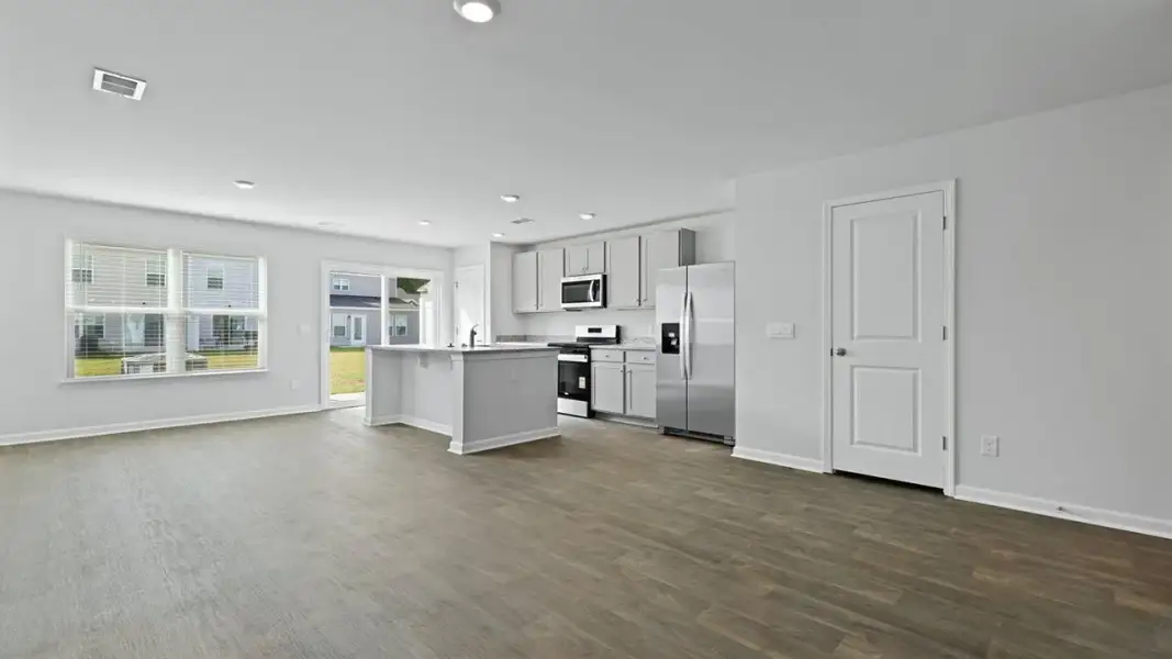 Spacious, unfurnished interior of a new home in Pine Hills Townhomes at Cane Bay, Summerville (Image 9). Spacious, unfurnished interior of a new home in Pine Hills Townhomes at Cane Bay, Summerville (Image 9).