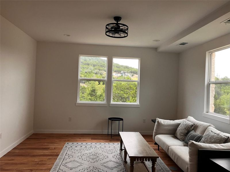 Living area featuring wood finished floors and healthy amount of natural light