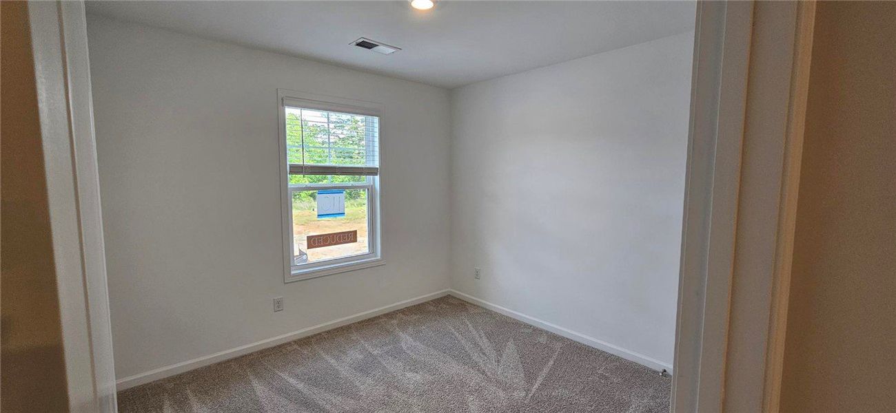 Bright and inviting bedroom with ample natural lig Bright and inviting bedroom with ample natural lig
