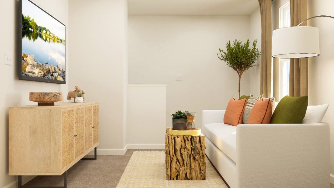 A living room with a white couch and a coffee table.