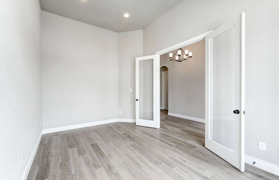 Representative unfurnished interior of a home built from the 2870 by Ravenna Homes in The Woodlands Hills 65′, Willis (Image 22). Representative unfurnished interior of a home built from the 2870 by Ravenna Homes in The Woodlands Hills 65′, Willis (Image 22).