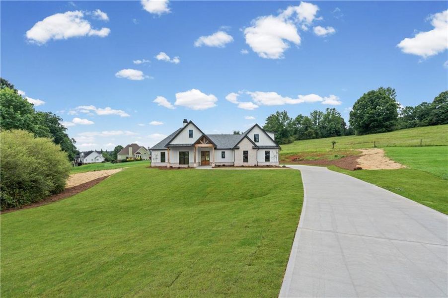 Front exterior of a new home in , Clermont, GA, highlighting curb appeal (Image 31). Front exterior of a new home in , Clermont, GA, highlighting curb appeal (Image 31).