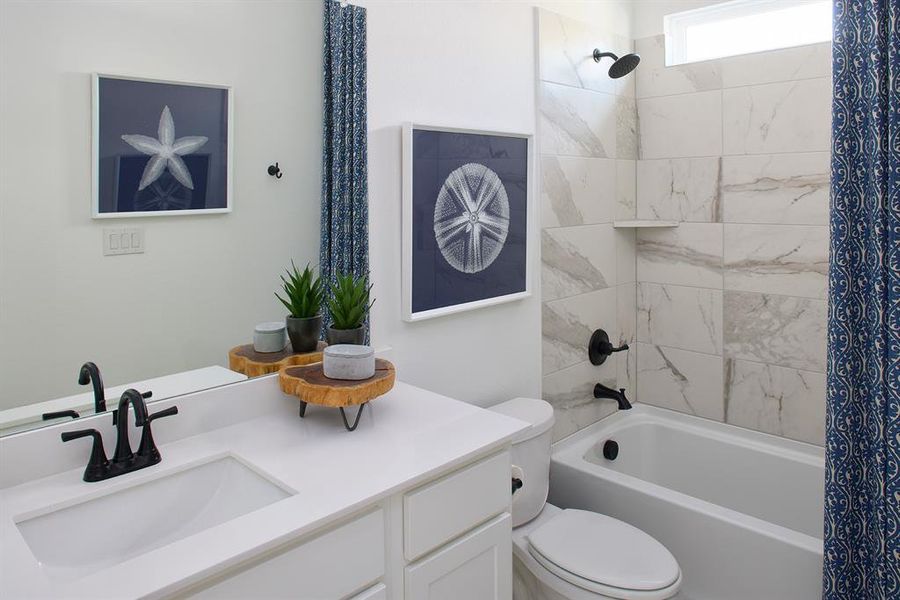 Full bathroom featuring vanity and shower / tub combo with curtain