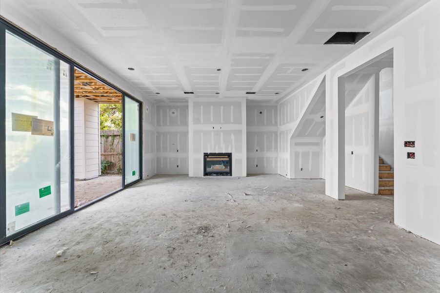 The spacious living area opens to a covered patio and welcoming backyard. The spacious living area opens to a covered patio and welcoming backyard.