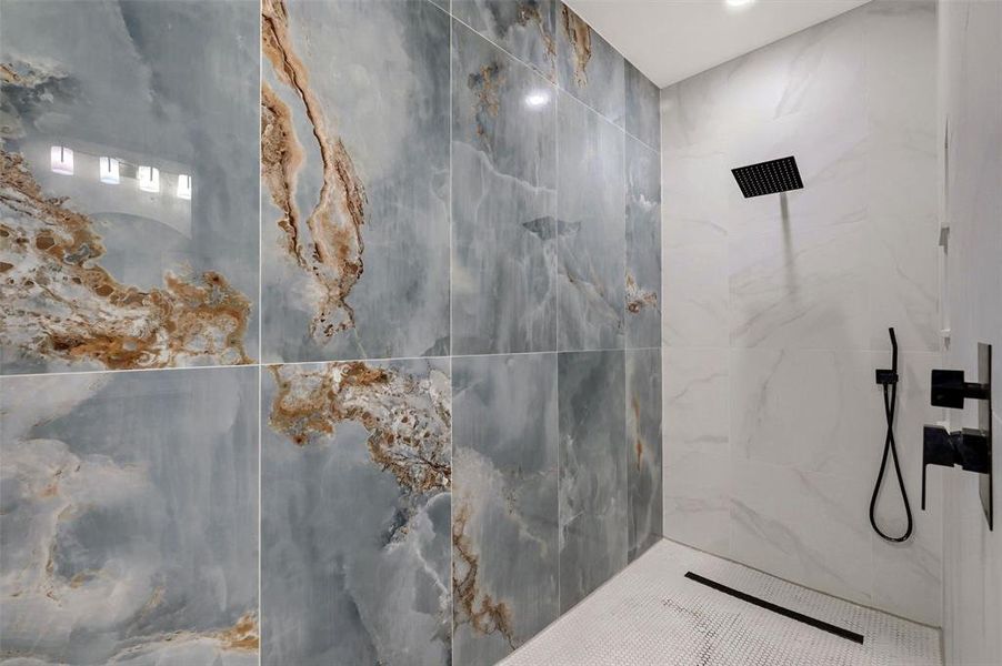 Bathroom featuring a tile shower