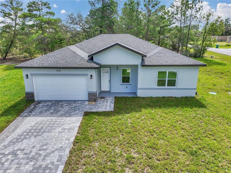 Front exterior of a new home in , Citrus Springs, FL, highlighting curb appeal (Image 20). Front exterior of a new home in , Citrus Springs, FL, highlighting curb appeal (Image 20).