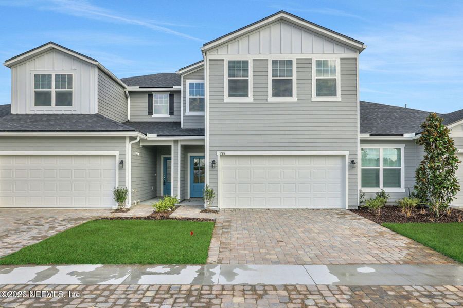Front exterior of a new home in Cherry Elm at SilverLeaf, St. Augustine, FL, highlighting curb appeal (Image 24).