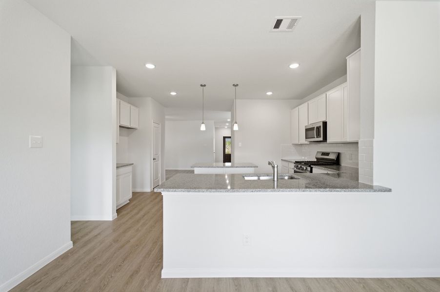 Furnished interior view inside a new home in The Pines at Seven Coves, Willis (Image 9).
