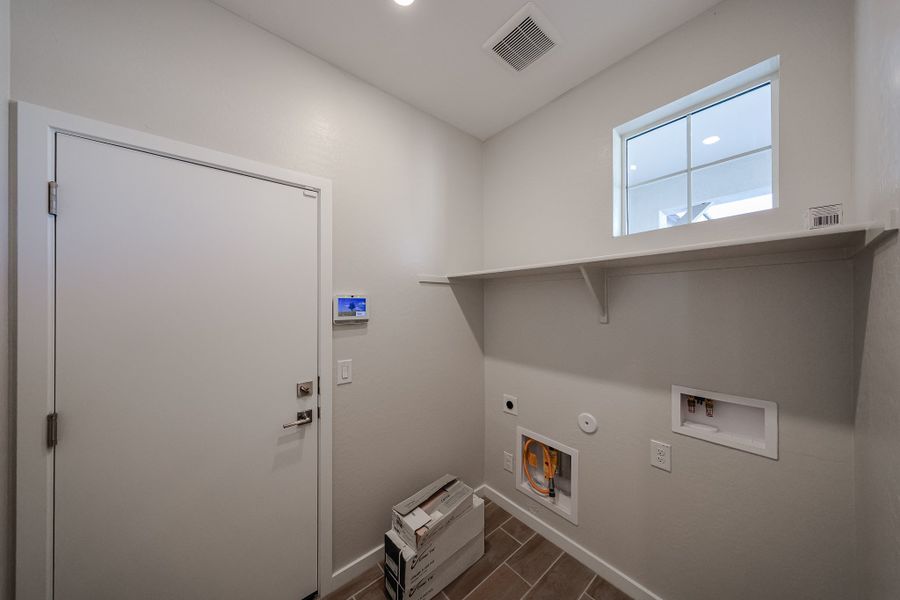 A room with a white door and a white wall with a window. A room with a white door and a white wall with a window.