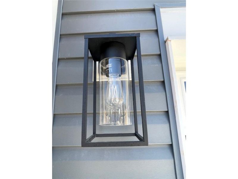 This sleek outdoor light fixture adds a modern tou