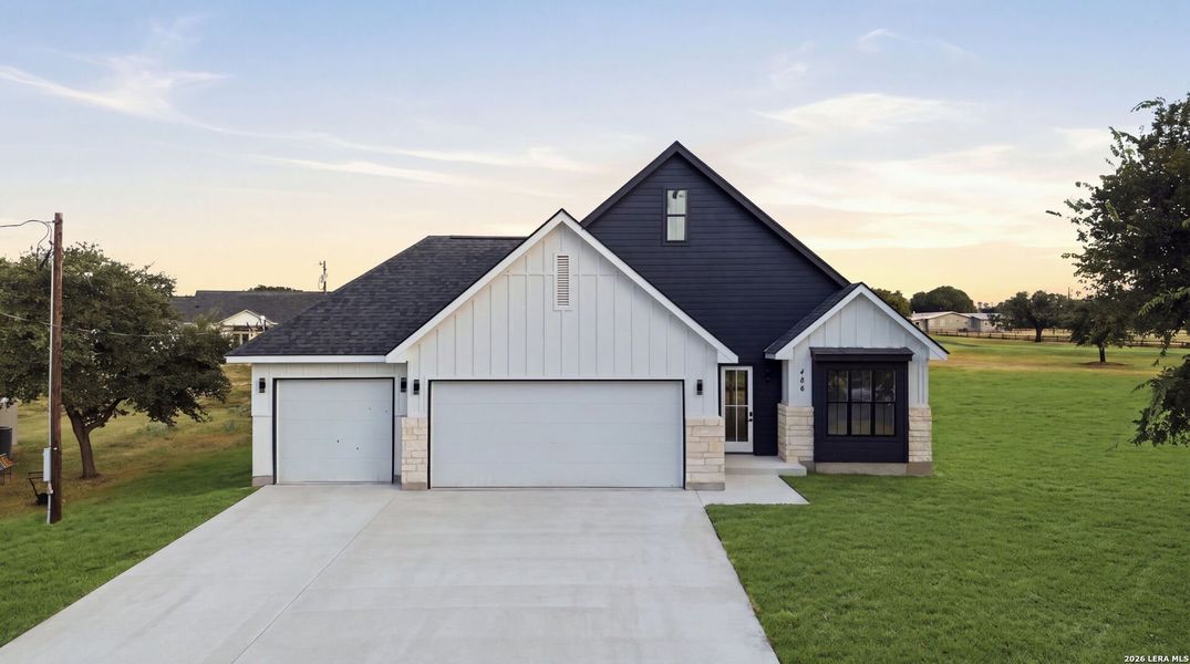 Front exterior of a new home in , Bandera, TX, highlighting curb appeal (Image 27).