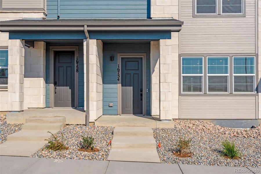 Front exterior of a new home in , Arvada, CO, highlighting curb appeal (Image 20).