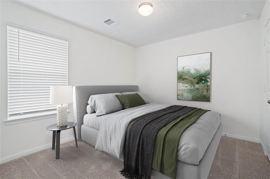 Secondary bedroom features plush carpet, neutral paint, lighting, large window with privacy blinds and ample sized closet space.