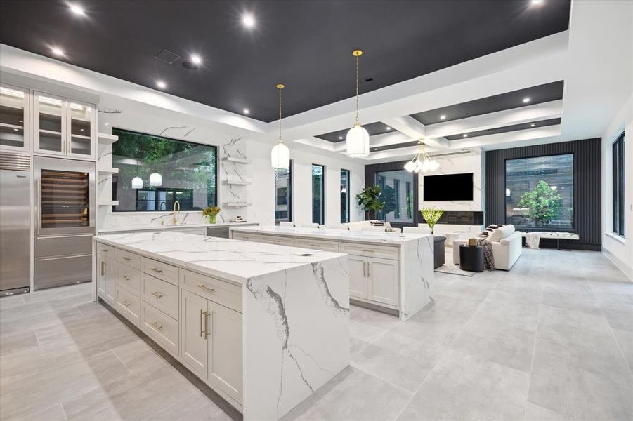 Another view of the kitchen highlighting the openness towards the Great Room and natural light from the bounty of large windows