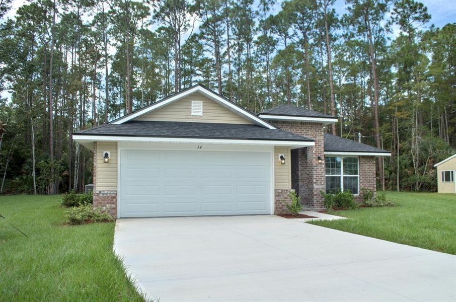 Front exterior of a new home in , Palm Coast, FL, highlighting curb appeal (Image 18). Front exterior of a new home in , Palm Coast, FL, highlighting curb appeal (Image 18).
