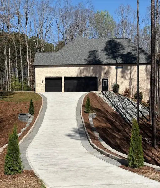 Beautiful, large driveway to your 3-car Garage