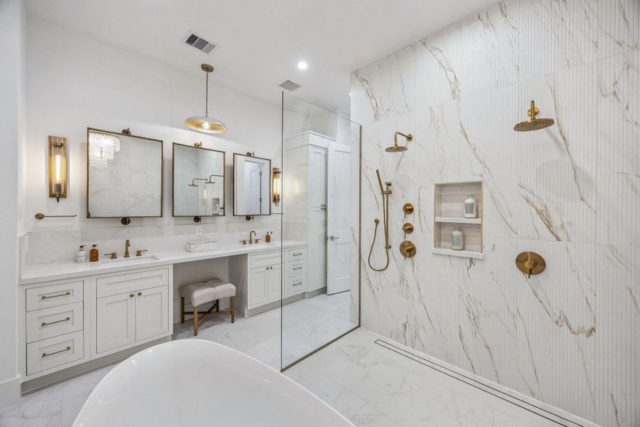 Large Open Shower with a Glass Wall. The Floor in the Shower is a continuation of the 12 x 24 Marble Dolomite White Tile. The Shower Walls are Adorned with Ribbed Urbanslat Marmi Gold Tile and Marble Dolomite White Tile. Large Open Shower with a Glass Wall. The Floor in the Shower is a continuation of the 12 x 24 Marble Dolomite White Tile. The Shower Walls are Adorned with Ribbed Urbanslat Marmi Gold Tile and Marble Dolomite White Tile.