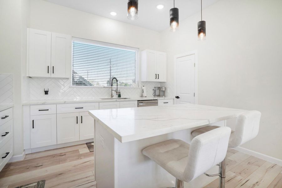 Beautiful island is the focal point of this kitchen. Walk in pantry is located to the right of the sink.