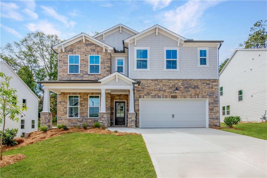 Front exterior of a new home in Hopewell Reserve, Cumming, GA, highlighting curb appeal (Image 2).