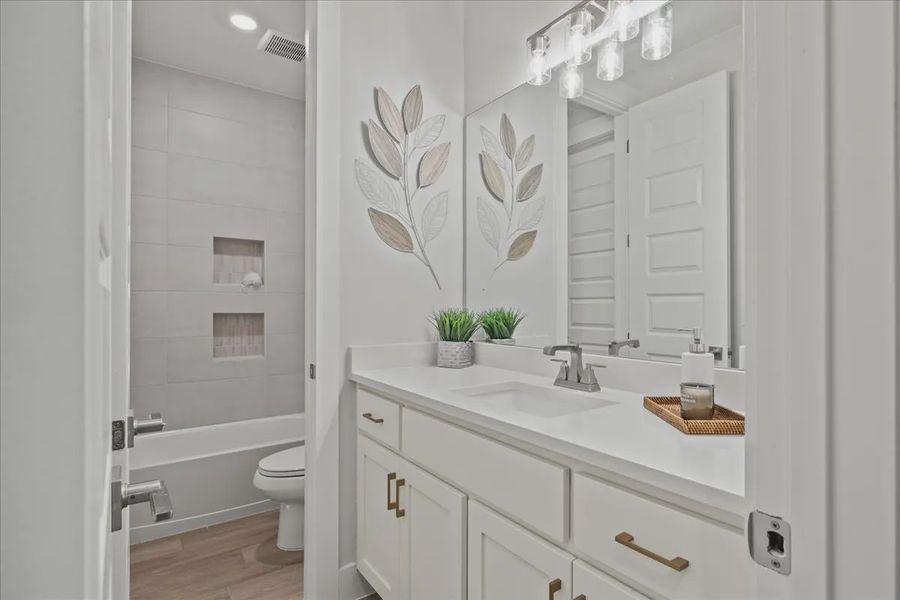 Representative furnished interior of a home built from the Bradley by Chesmar Homes in Sweetwater, Austin (Image 15).