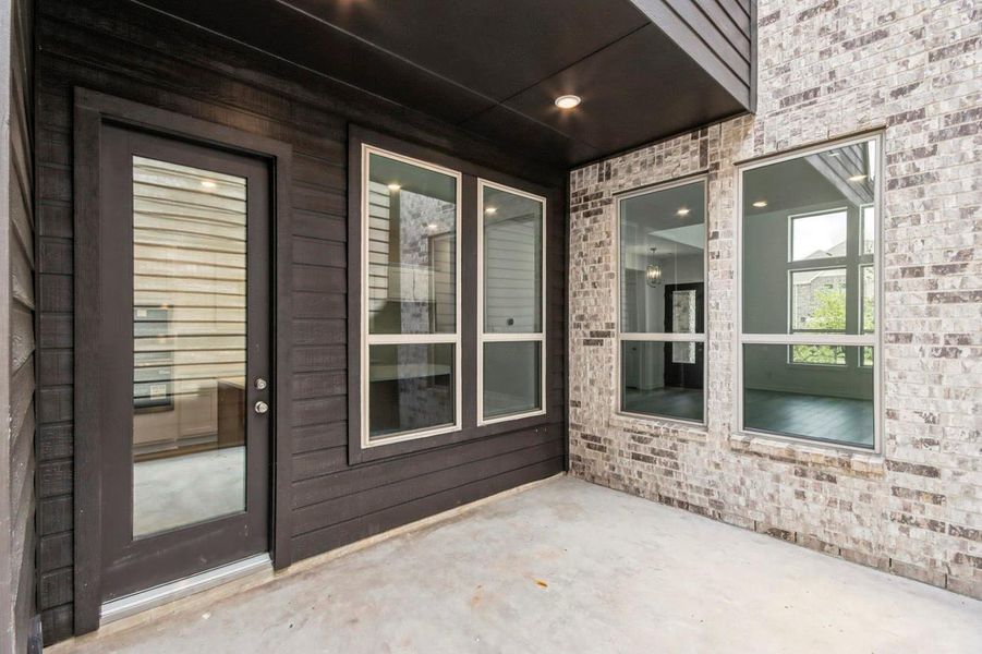 Exterior details and patio area of a home in Woodforest Townhomes, Montgomery (Image 3). Exterior details and patio area of a home in Woodforest Townhomes, Montgomery (Image 3).