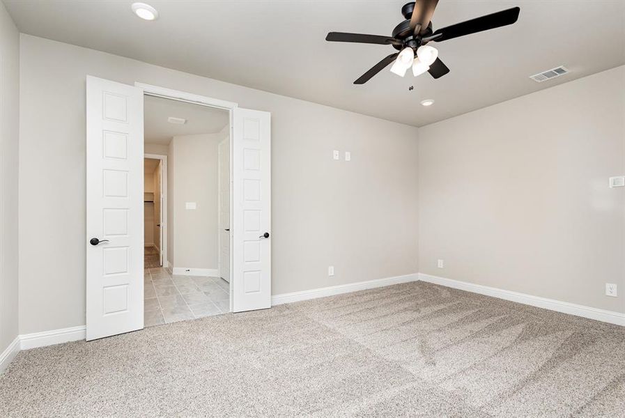 Spare room featuring light carpet, recessed lighting, and ceiling fan