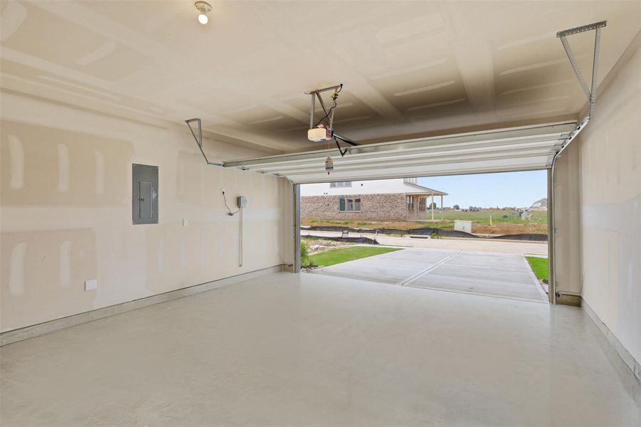 Spacious two car garage with wide entry, offering plenty of room for parking, storage, and everyday convenience, a practical feature every homeowner will appreciate. Spacious two car garage with wide entry, offering plenty of room for parking, storage, and everyday convenience, a practical feature every homeowner will appreciate.