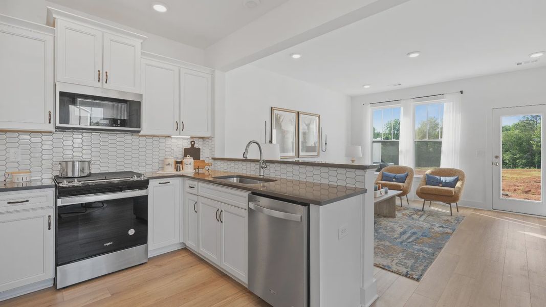 Refined kitchen layout of The Churchill Design offering both entertaining space and everyday functionality
