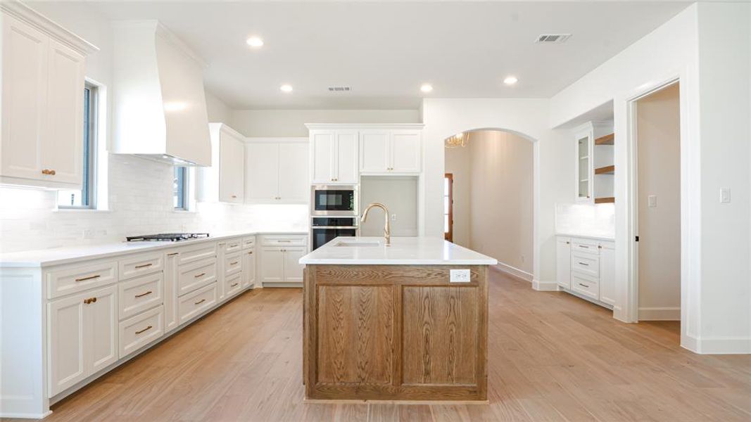 Spare room featuring light carpet and a ceiling fan Spare room featuring light carpet and a ceiling fan