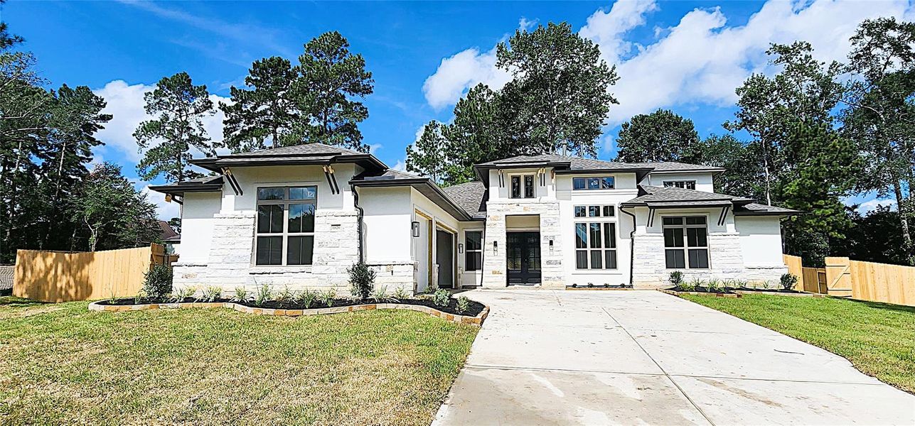 Front exterior of a new home in Stewart’s Forest, Conroe, TX, highlighting curb appeal (Image 1). Front exterior of a new home in Stewart’s Forest, Conroe, TX, highlighting curb appeal (Image 1).
