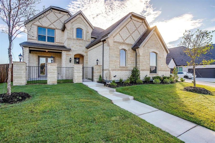 French country home with a front yard