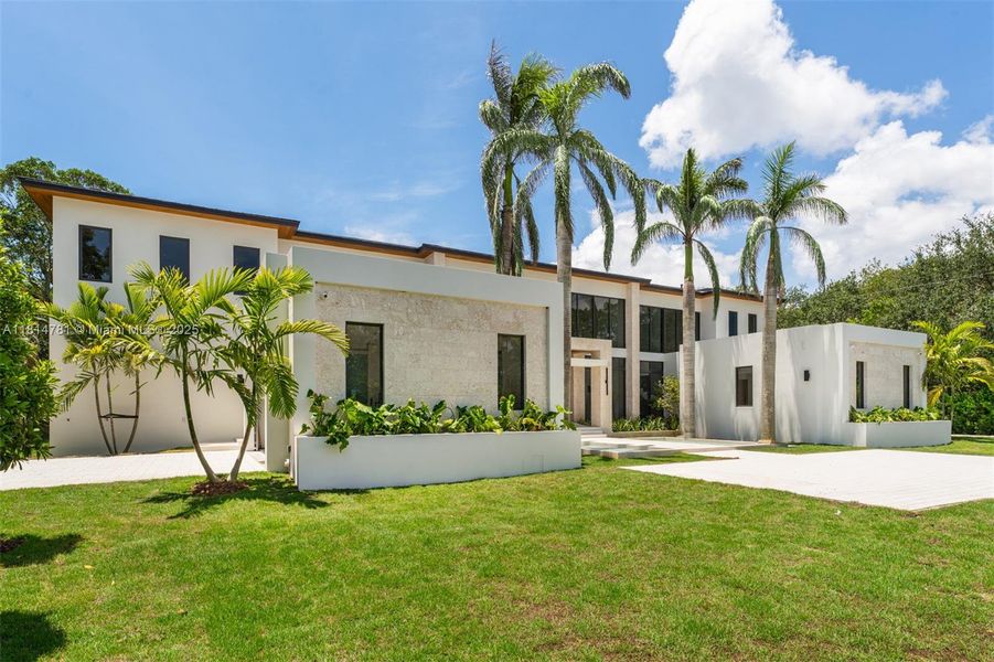 Front exterior of a new home in , Pinecrest, FL, highlighting curb appeal (Image 38).