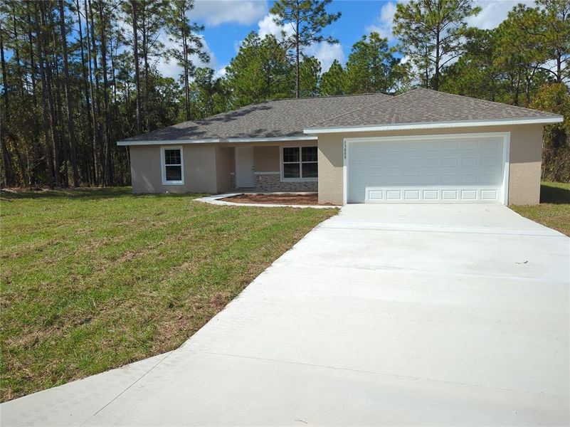 Front exterior of a new home in , Ocala, FL, highlighting curb appeal (Image 2). Front exterior of a new home in , Ocala, FL, highlighting curb appeal (Image 2).