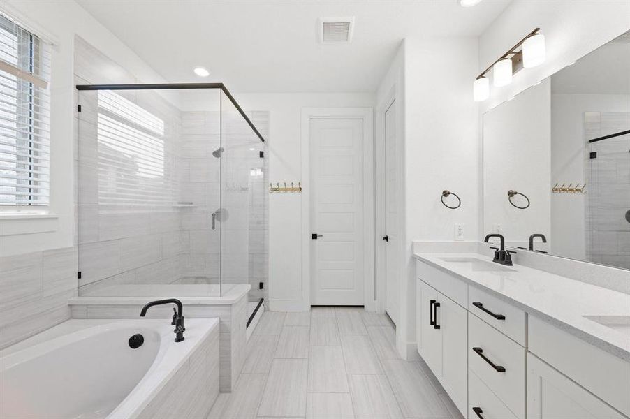 Contemporary bathroom featuring a spacious walk-in shower with clear glass enclosure and contrasting black hardware Contemporary bathroom featuring a spacious walk-in shower with clear glass enclosure and contrasting black hardware