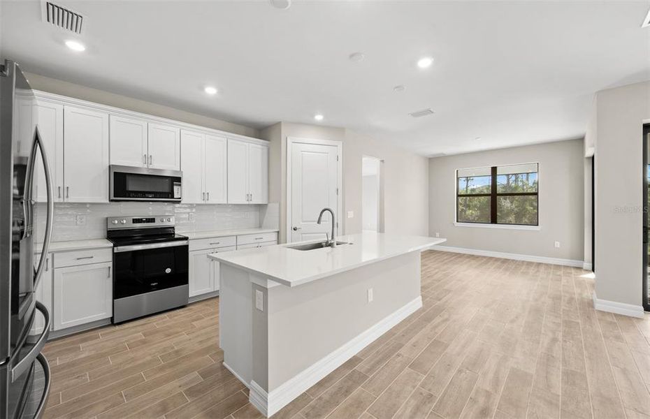 Furnished interior view inside a new home in Cedar Grove at The Woodlands, North Port (Image 13).