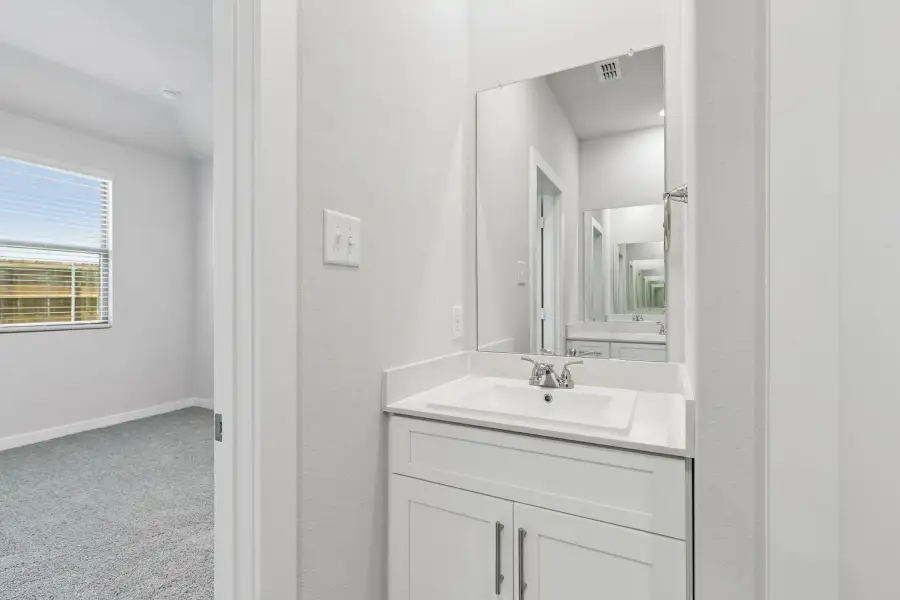 Primary Bathroom in the Cypress home plan by Trophy Signature Homes - REPRESENTATIVE PHOTO