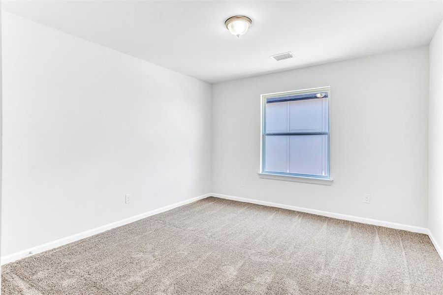 Unfurnished room with carpet flooring