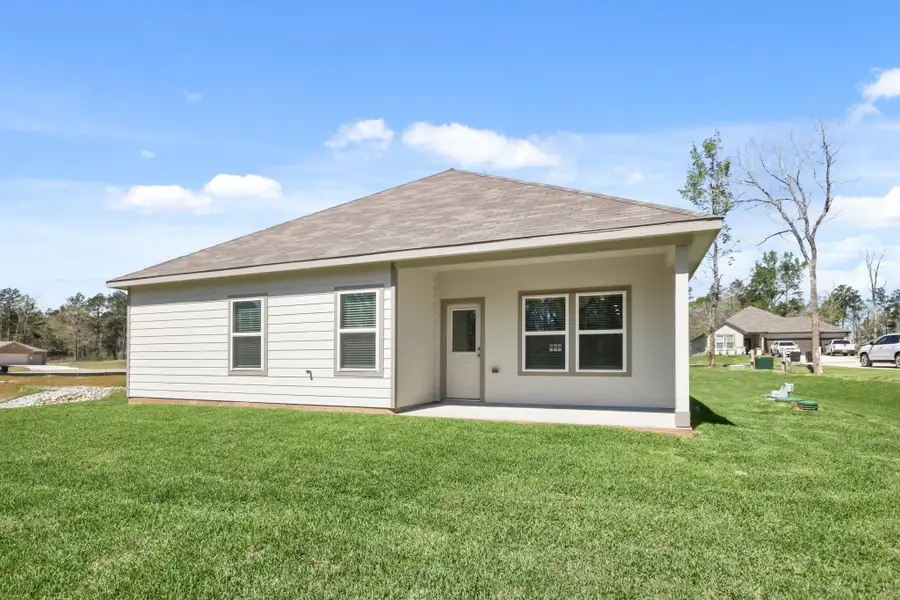 Exterior details and patio area of a home in Oakwood Ranch, Willis (Image 3).