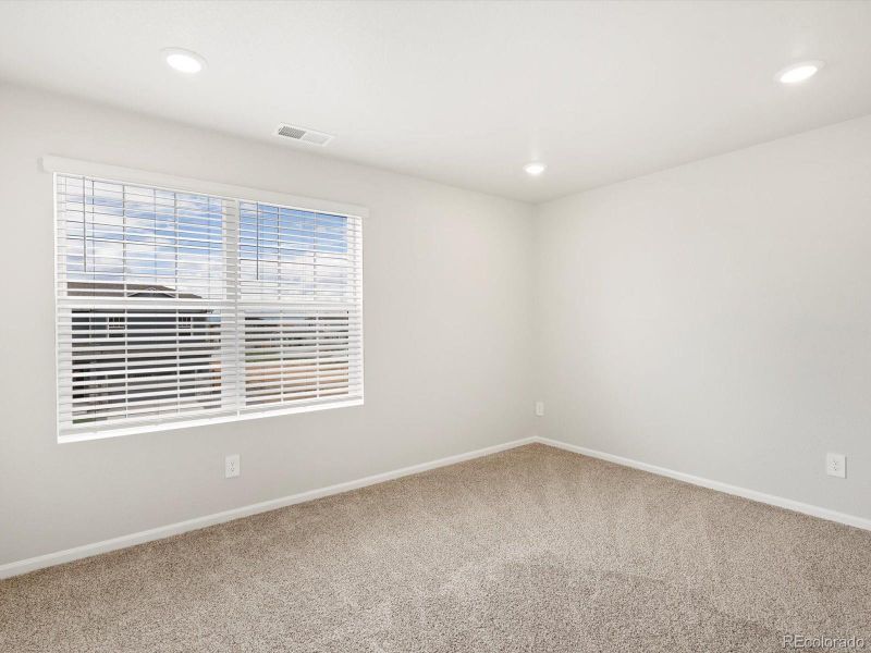 Spacious, unfurnished interior of a new home in Buffalo Highlands: The Flora Collection, Commerce City (Image 17).