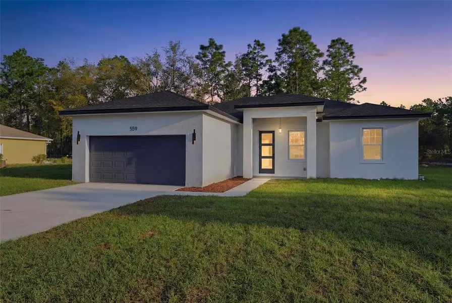 Front exterior of a new home in , Dunnellon, FL, highlighting curb appeal (Image 1). Front exterior of a new home in , Dunnellon, FL, highlighting curb appeal (Image 1).