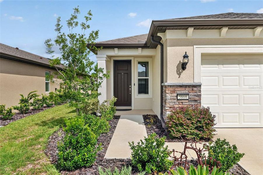 Exterior details and patio area of a home in Del Webb Stone Creek, Ocala (Image 27).