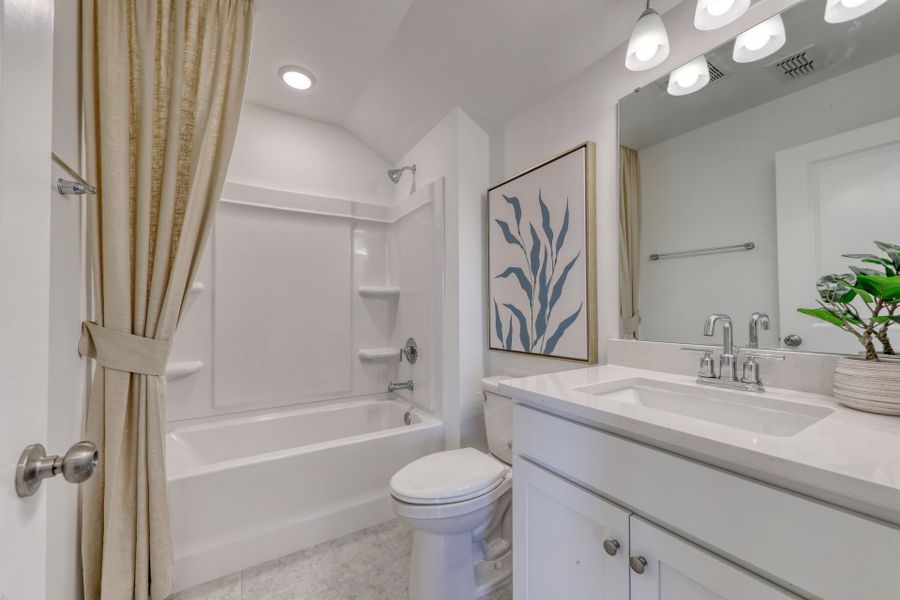 Guest Bathroom with Soaking Tub. Model Home Representation.