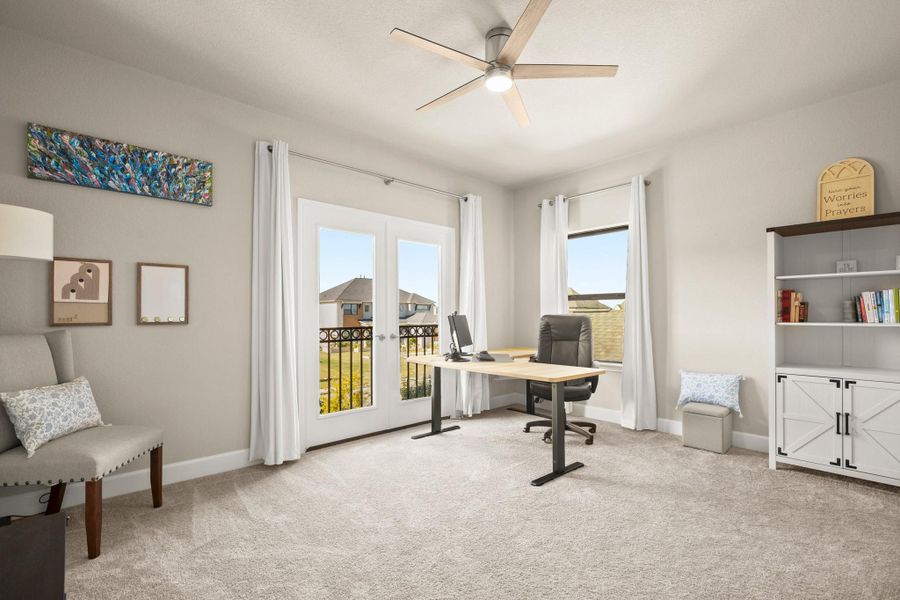 Home office with light carpet, healthy amount of natural light, a ceiling fan, and french doors Home office with light carpet, healthy amount of natural light, a ceiling fan, and french doors