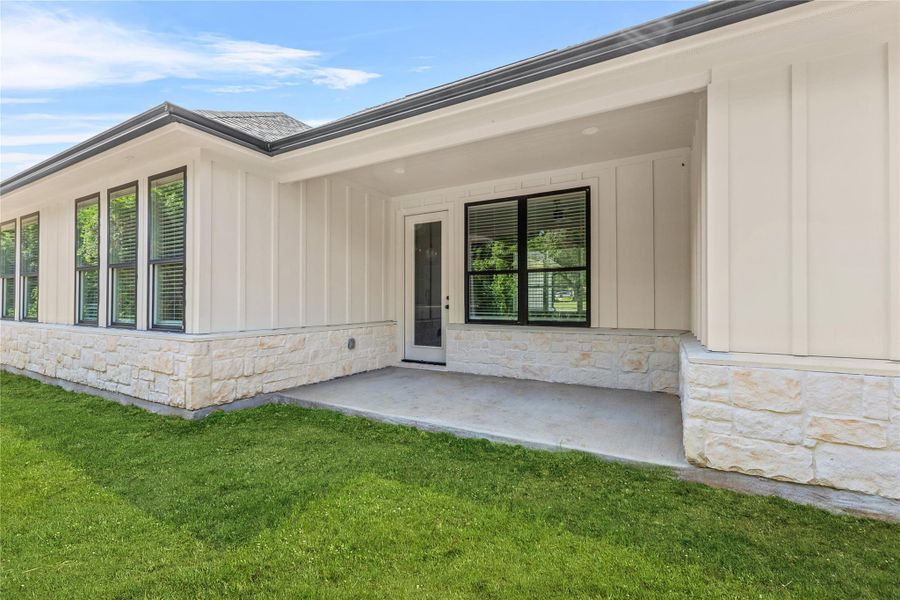 Front exterior of a new home in , Brenham, TX, highlighting curb appeal (Image 2).