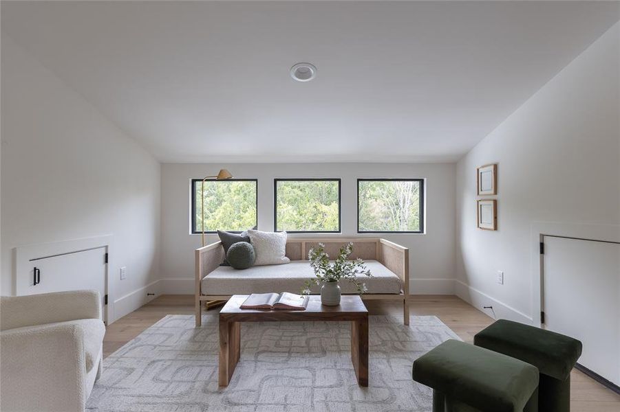 Beautiful window detail and vaulted ceiling bring such personality to this space!