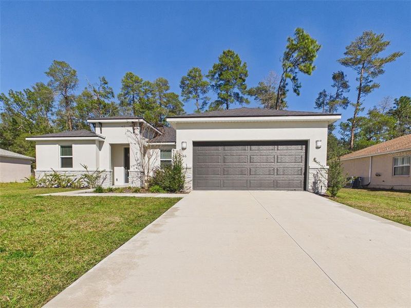 Front exterior of a new home in , Ocala, FL, highlighting curb appeal (Image 1). Front exterior of a new home in , Ocala, FL, highlighting curb appeal (Image 1).