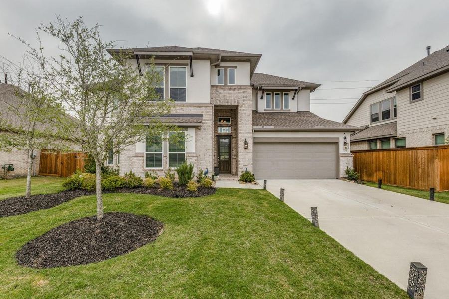Front exterior of a new home in , Cypress, TX, highlighting curb appeal (Image 23).