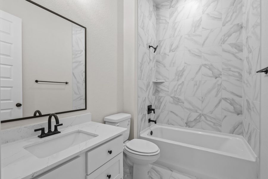 A bathroom with a shower curtain. A bathroom with a shower curtain.