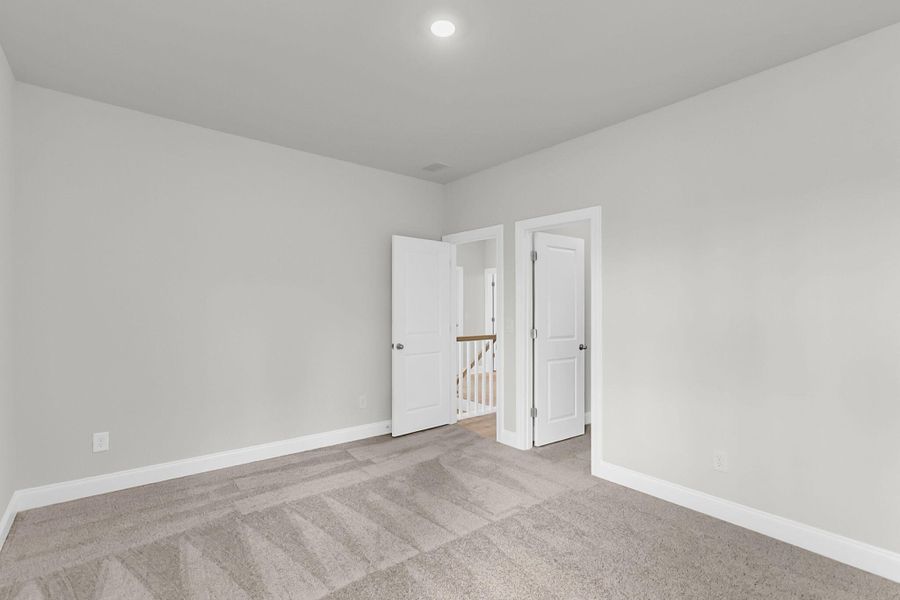 Spacious, unfurnished interior of a new home in Tidewater at Lakes of Cane Bay, Summerville (Image 38). Spacious, unfurnished interior of a new home in Tidewater at Lakes of Cane Bay, Summerville (Image 38).