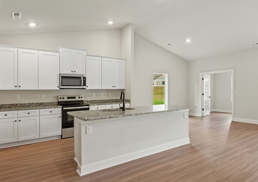 the kitchen has designer wood cabinetry